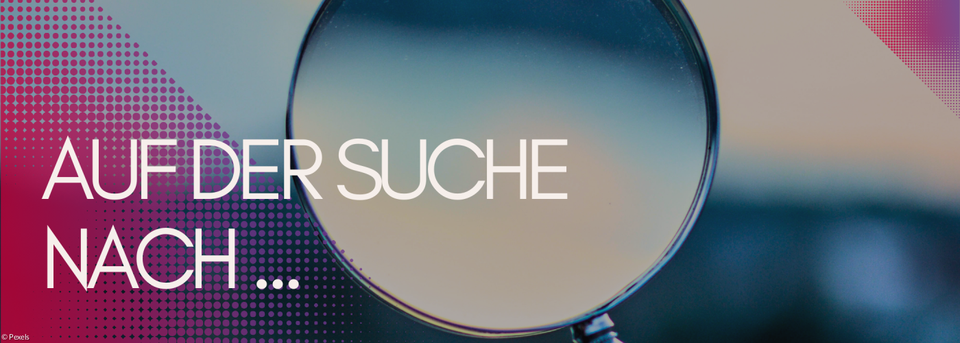 Lupe vor unscharfen Hintergrund.